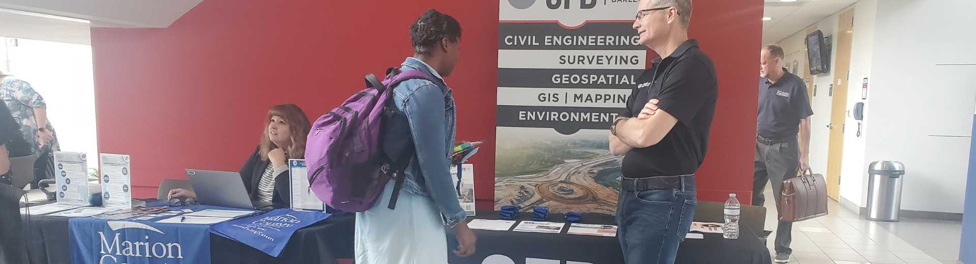CFB Civil Engineering talking to a student at GID professionals day