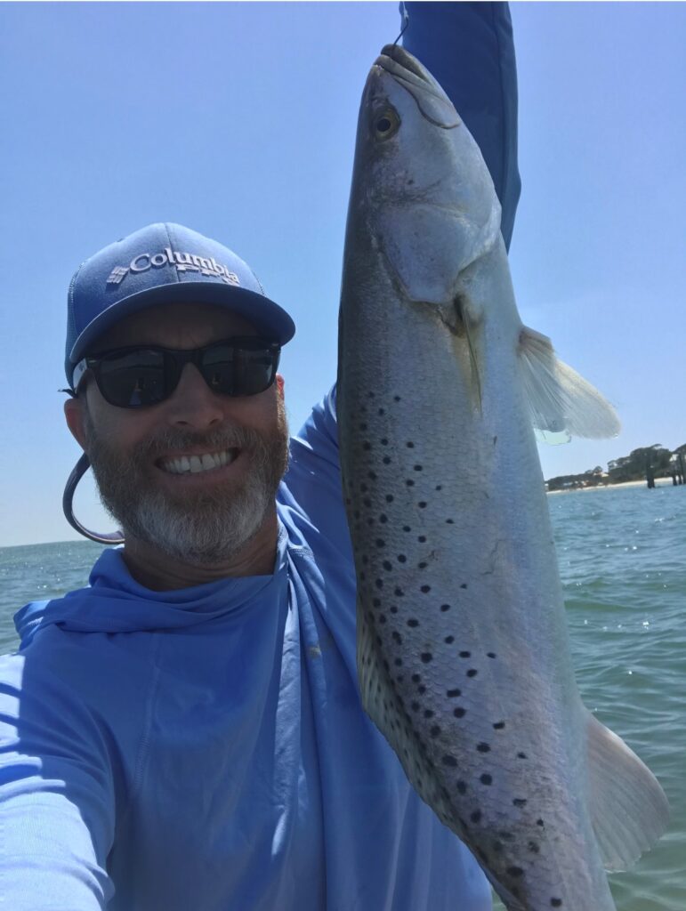 David Loy CFB's Environmental Sciences Director showing off a caught fish