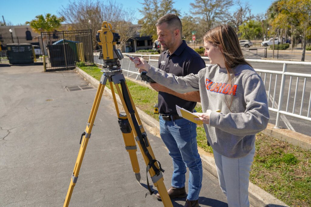 CFB Land Surveyor mentors UF geomatics student on collecting accurate measurements in Ocala Florida.