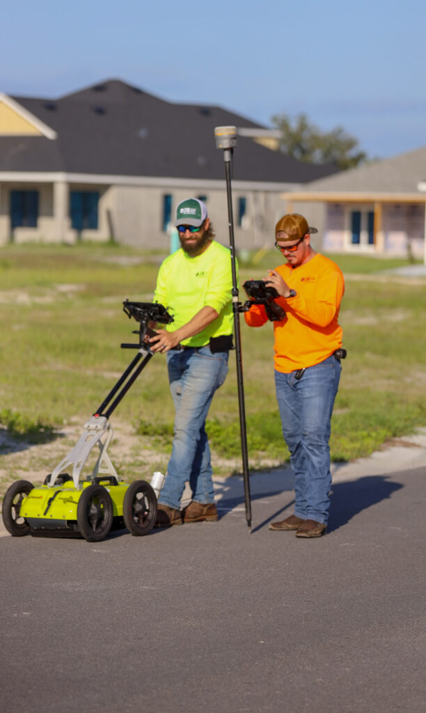 SUE crew with ground penetrating radar and GPS equipment.